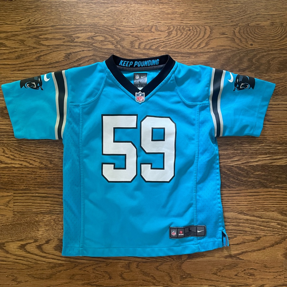 Panthers kuechly jersey please note sizing says large looks like a 6-7t to me
